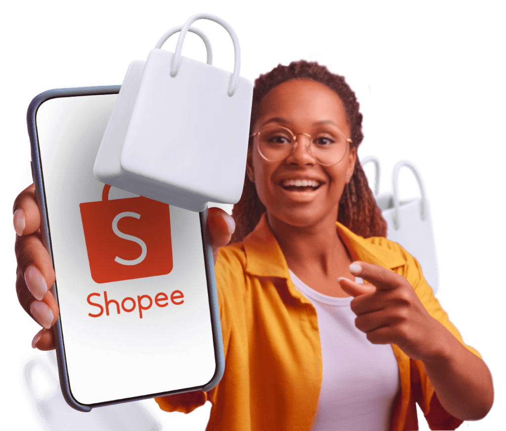 Imagem: Uma mulher negra com uma camisa laranja sorrindo enquanto estica o braço mostrando o celular com a logo da shopee